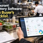 Chef using a tablet to compare restaurant inventory management software in a commercial kitchen